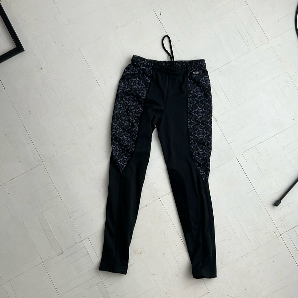 Kerrits black and purple horse print riding pants.
